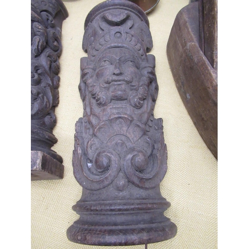 343 - Pair of C19th oak fire surround corbel with carved relief decoration of a male and female facemask, ... 