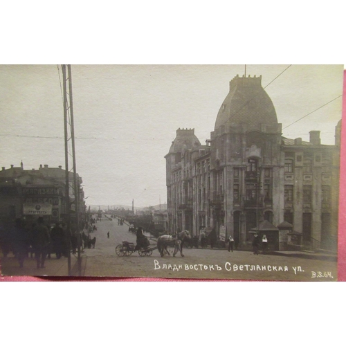 488 - Three WWI period real photographic postcards depicting images of Vladivostok, one showing troops mar... 