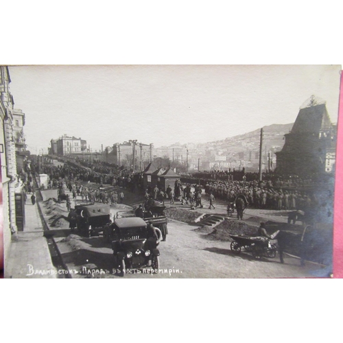 488 - Three WWI period real photographic postcards depicting images of Vladivostok, one showing troops mar... 