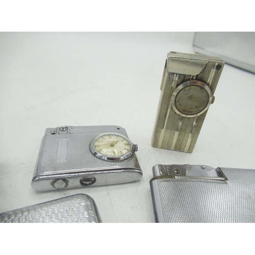 766 - 3 lighters and 2 lighter/cigarette cases with clocks inbuilt by Ingersoll, Aircraft and Swank (5)