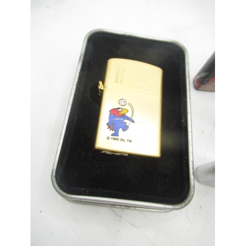 769 - FIFA world cup 1998 lighter, Ronson American football lighter, 2 Streamline lighters on with Swimmin... 