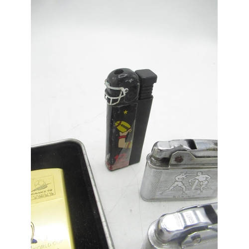 769 - FIFA world cup 1998 lighter, Ronson American football lighter, 2 Streamline lighters on with Swimmin... 