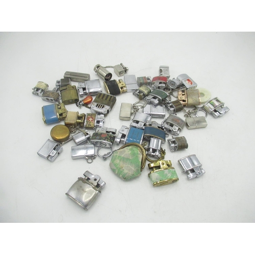 770 - Large collection of miniature lighters inc. one with a miniature ladies hand bag (38)