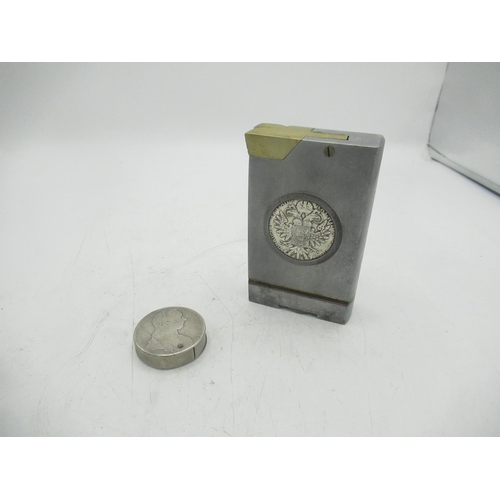 771 - Large metal lighter with Maria Theresa coin encased and a circular Maria Theresa coin lighter (2)