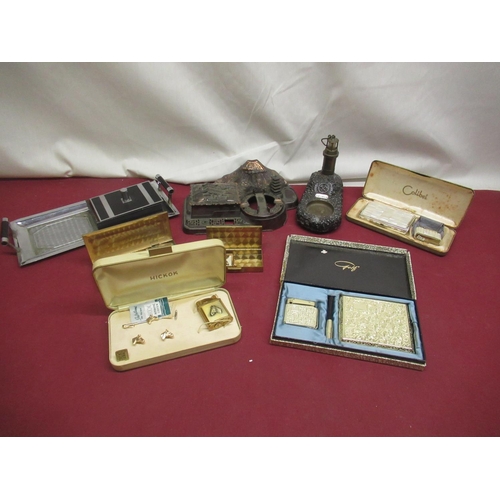 802 - Japanese design ash tray, lighthouse ashtray, 5 lighter and cigarette case sets and a partial lighte... 