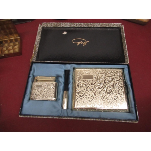 802 - Japanese design ash tray, lighthouse ashtray, 5 lighter and cigarette case sets and a partial lighte... 