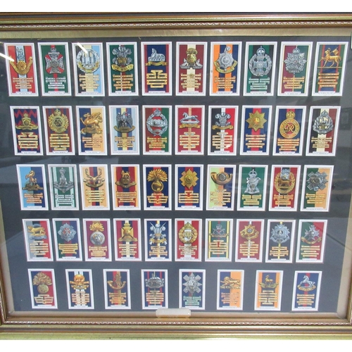 1101 - Framed and mounted display of British army Regimental cap badge cigarette cards