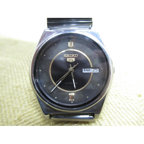 693 - Seiko 5 automatic with English & Arabic day and date, stainless steel TV format case, screw off case... 