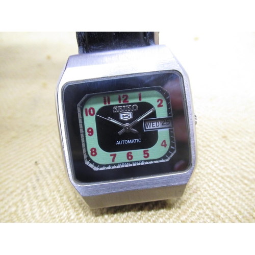 693 - Seiko 5 automatic with English & Arabic day and date, stainless steel TV format case, screw off case... 