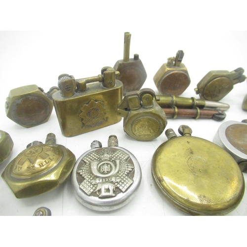 703 - Trench Art lighters from WWI & WWII inc. Royal Marines, La Defence de Verdun 1916, Scots Guard, Glas... 