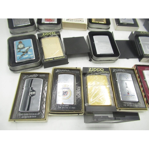 710 - Collection of boxed Zippo lighters inc. Ballantine's Gold Seal, Jim Bean, Jack Daniels, the battle o... 