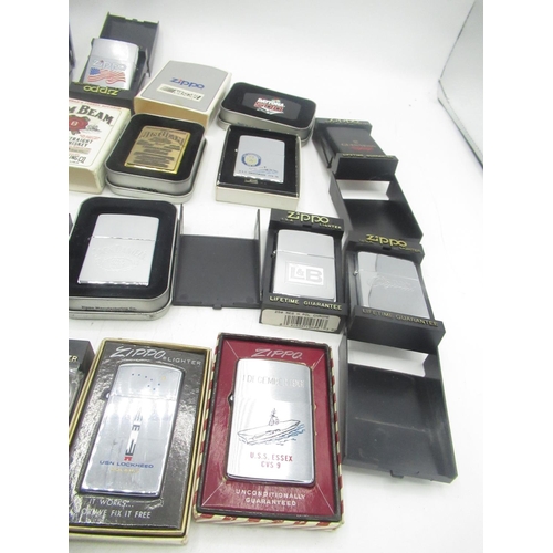 710 - Collection of boxed Zippo lighters inc. Ballantine's Gold Seal, Jim Bean, Jack Daniels, the battle o... 