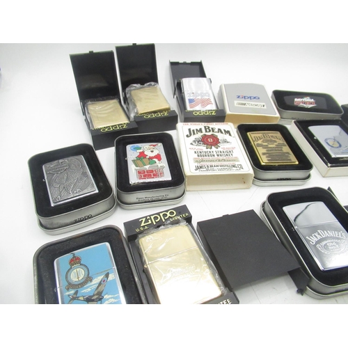 710 - Collection of boxed Zippo lighters inc. Ballantine's Gold Seal, Jim Bean, Jack Daniels, the battle o... 