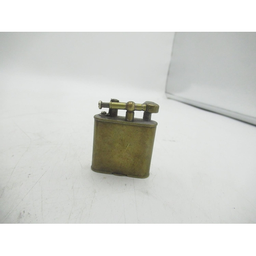 727 - Two early Dunhill brass Unique Lighters and a Dunhill double wheel lighter(3)