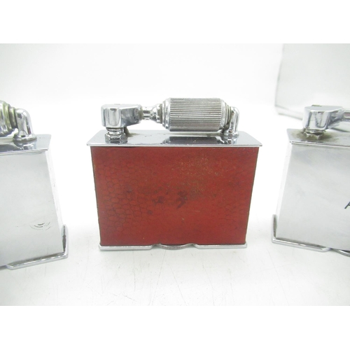 729 - Three McMurdo table lighters