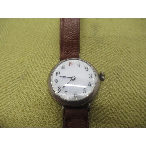 670 - Two early C20th ladies silver cased trench style wristwatches, 1920's cushion cased chrome plated wr... 