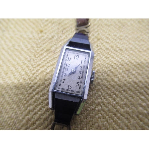 671 - 1930's ladies cocktail watch in chrome plated case with faceted blue glass shoulders, with silvered ... 