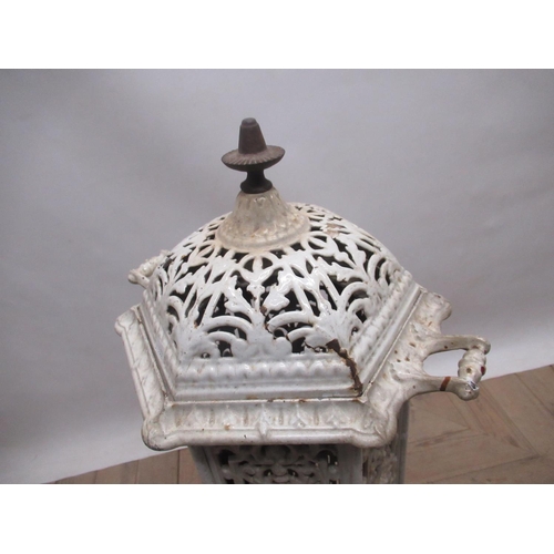 635 - French white enamelled cast iron heater, hexagonal body with colour panels, hinged door and removabl... 