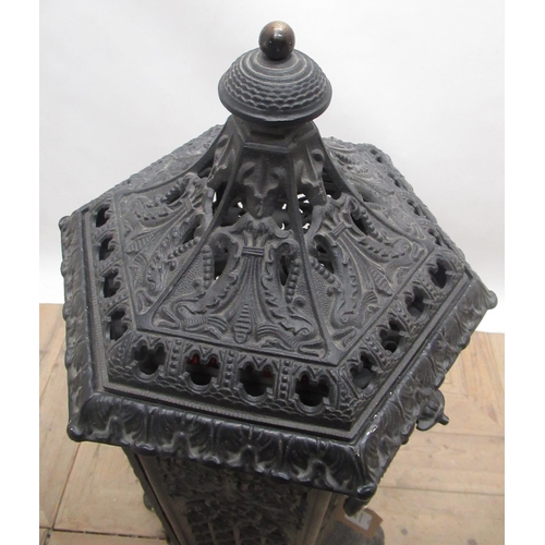 636 - French cast iron heater, hexagonal body with colour panels, hinged door and brass burner, the remova... 