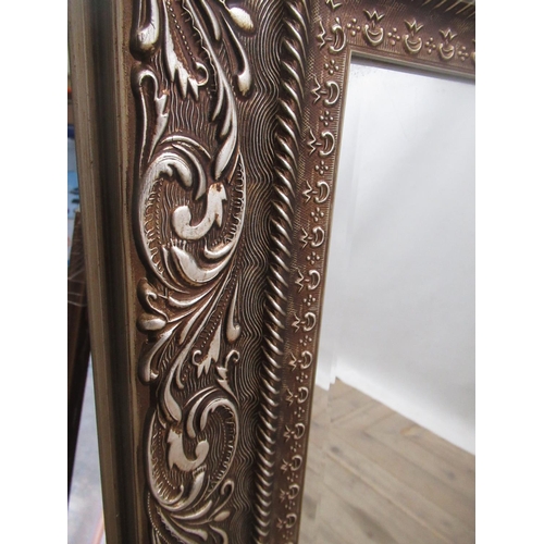 632 - Victorian style wall mirror in Champagne scroll moulded frame, 103cm x 74cm