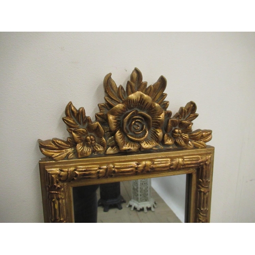 633 - Regency style pier mirror, gilt finish with floral cresting, 24cm x 128cm