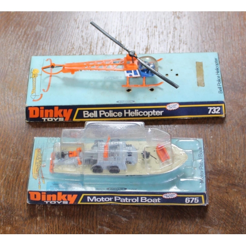 871 - Dinky Bell police helicopter on original mount and a Dinky motorpatrol boat 675 on its original moun... 