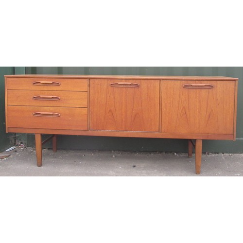 592 - Mid-century Nathan teak sideboard with three drawers, a fall front and a cupboard on square supports... 