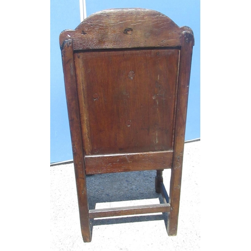 1300 - C18th and later oak Wainscot type chair, arched panelled back and solid seat with shaped arms on tur... 