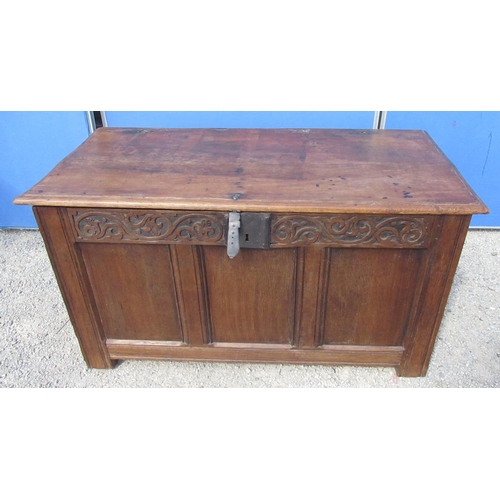 1301 - C18th oak coffer, hinged top with moulded edge, three panel front with scroll carved frieze, W120cm ... 