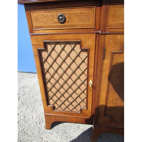 1305 - Regency style yew breakfront side cabinet, reeded top and three drawers above two panelled and two b... 