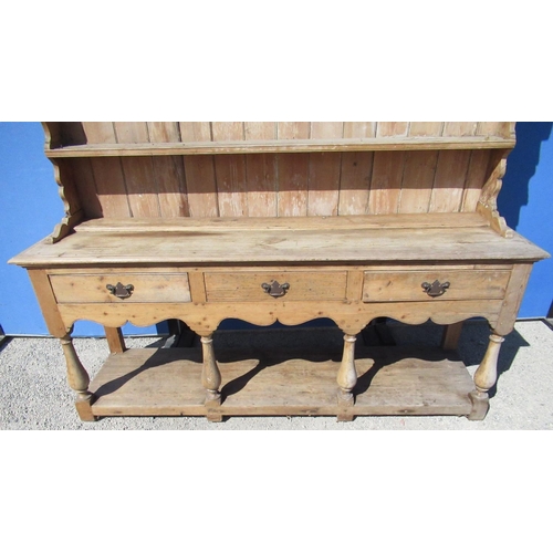 1295 - Pine open dresser, three tier panelled back with moulded cornice, base with three long drawers and s... 