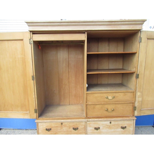 1296 - Pine Housekeepers type cupboard, moulded cornice above two panel doors and four short drawers, on sk... 