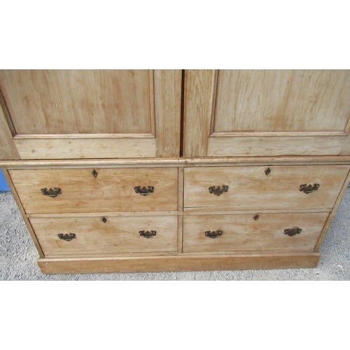 1296 - Pine Housekeepers type cupboard, moulded cornice above two panel doors and four short drawers, on sk... 