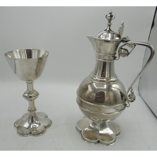 1046 - Geo.V hallmarked silver Communion wine ewer, hinged lid with crown finial, angular handle with leaf ... 