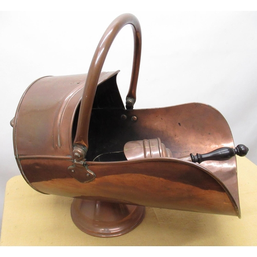 1115 - Early C20th copper coal helmet, with swing handle on tapering circular base, shovel with turned wood... 