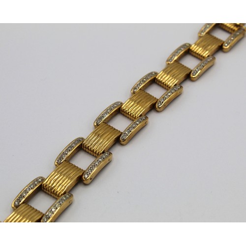 1003 - Cartier style yellow metal and diamond square link bracelet, set with one hundred and forty brillian... 