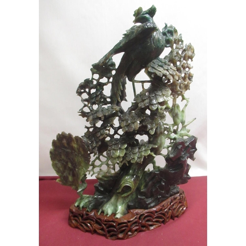 1102 - Large Chinese carved jadeite tableau of exotic 
birds, pheasants and cranes within profuse foliage, ... 