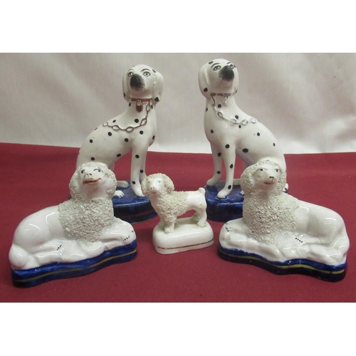 1135 - Pair of small Staffordshire Spaniels, another pair with black spotted markings, gilt collars and cha... 