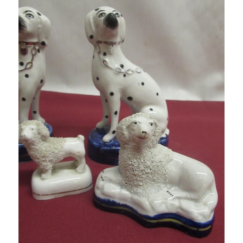 1135 - Pair of small Staffordshire Spaniels, another pair with black spotted markings, gilt collars and cha... 