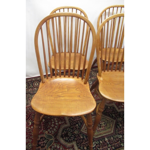 1279 - Set of four Treske Furniture elm Windsor type chairs, hoop and stick backs and shaped seats on turne... 