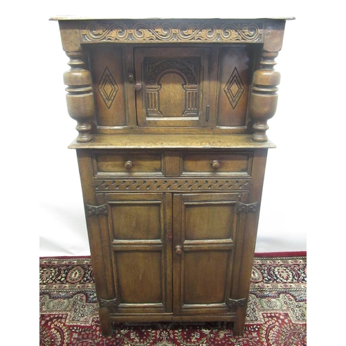 1344 - Small Titchmarsh & Goodwin carved oak court cupboard or Buffet, with arched door and long drawer abo... 