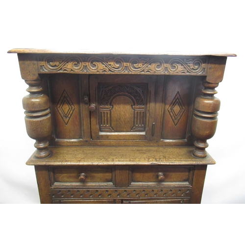 1344 - Small Titchmarsh & Goodwin carved oak court cupboard or Buffet, with arched door and long drawer abo... 