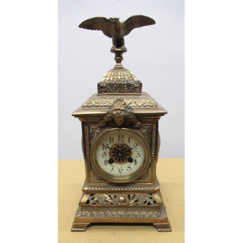 1265 - C20th brass cased mantel clock, square case with eagle finial, circular Roman dial on  pierced scrol... 