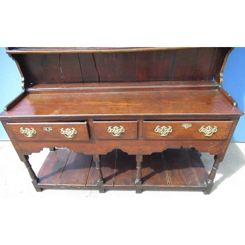 1318 - Geo. III open oak dresser, two tier planked back with moulded cornice and iron coat hooks, base with... 