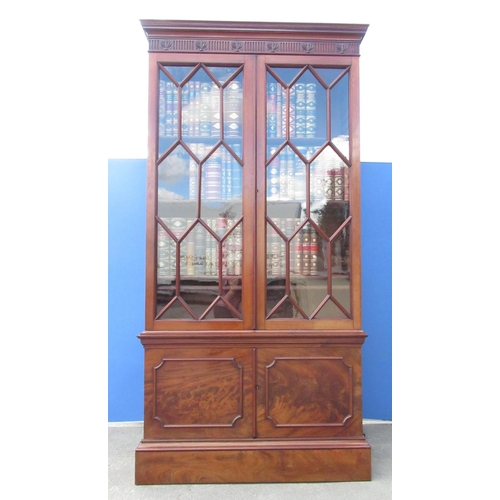 1316 - Large Victorian mahogany bookcase, moulded cornice with fluted frieze, two astragal  glazed doors en... 