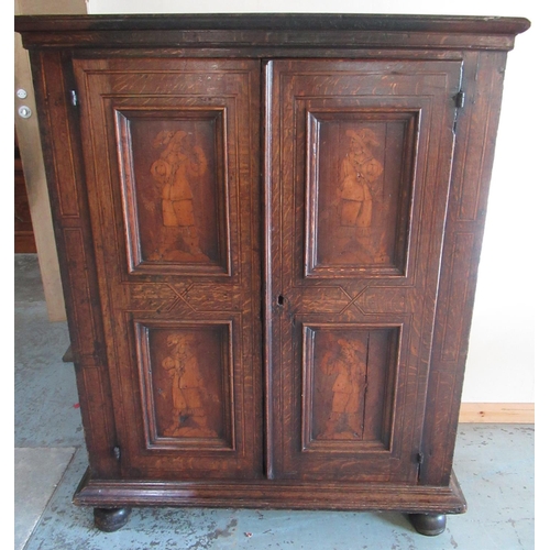 1320 - Early C19th Dutch ebonised strung oak side cabinet, the moulded top above two doors with four figura... 