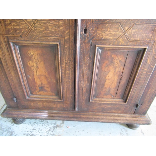 1320 - Early C19th Dutch ebonised strung oak side cabinet, the moulded top above two doors with four figura... 