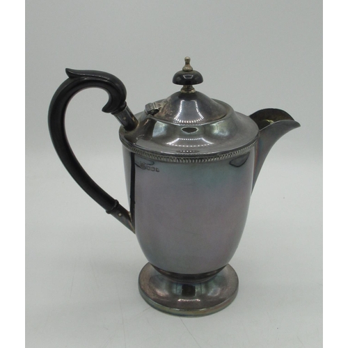 1049 - ERII hallmarked Sterling silver three piece tea service, teapot with ribbed rim, ebonised handle and... 