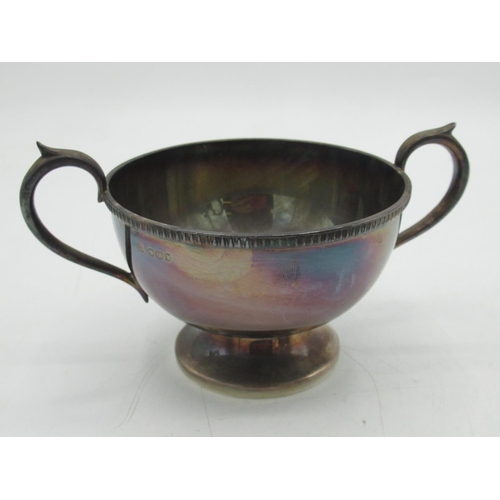 1049 - ERII hallmarked Sterling silver three piece tea service, teapot with ribbed rim, ebonised handle and... 