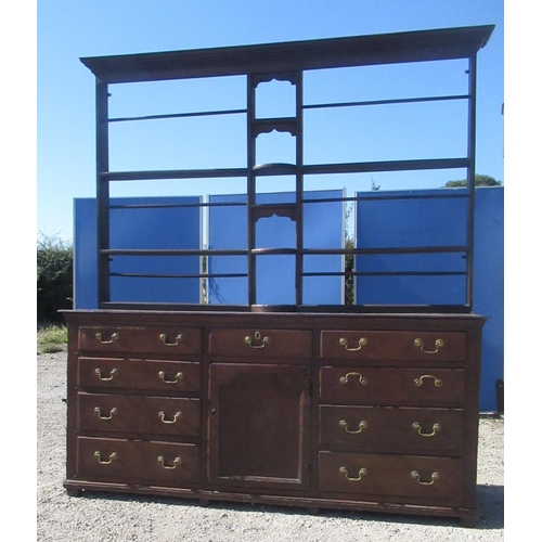 1321 - Geo.III oak dresser, three tier back with dentil cornice, moulded planked top and nine drawers with ... 